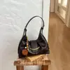 Bolso Retro Transfronterizo Debajo del Brazo para Mujer 2026 Nuevo Bolso Cruzado de Hombro de Nicho para Viajero Bolso Dumpling de Moda Casual