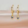 Pendientes de ojo de diablo con clip para la oreja, estilo transfronterizo europeo y americano, con hebilla de circonita azul tinta, para mujer.