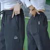 Vendedor Caliente de Douyin Fábrica de Origen Pantalones Casuales de Sarga Tejida Moda Masculina Versátiles Pantalones Deportivos Pantalones de Chándal Hombres Venta al por Mayor