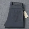 2026 Nova Marca Tendência Primavera e Outono Calça Jeans de Algodão Retrô Masculina Elástica Casual de Negócios Calça Reta Solta