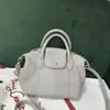 Venta al por mayor transfronteriza de bolsos de mano estilo dumpling de piel de vaca de primera capa estilo coreano, bolsos cruzados, bolsos de cuero genuino suave simples urbanos casuales para mujer