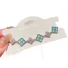 Pulsera de trébol de cuatro hojas de circón para mujer, joyería floral de diseño de nicho de lujo ligero, pulsera de temperamento de moda de alta gama