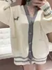 Chamarra suéter estilo universitario coreano 2026 otoño e invierno talla grande holgada casual nueva cardigan de punto con cuello en V