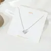 Collar de amor sencillo de estilo japonés y coreano, cadena de clavícula con astas cruzadas, flor, perla y colgante de latido de corazón de celebridad cibernética.