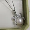 Ganchos para Orejas con Lazo Estilo Francés y Perlas Naturales, Sencillos y Versátiles, Colgante Elegante y Lujoso, Conjunto Exquisito de Diseño Nicho para Mujeres