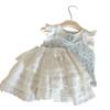 Ropa Infantil Estilo Coreano 2026 Nuevo Conjunto de Dos Piezas Verano Niñas: Chaleco de Mangas Volantes con Estampado Floral y Pantalones Falda con Tirantes y Ribete de Encaje Blanco