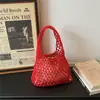 2026 Nova Bolsa de Mão Clutch de Malha Vazada Estilo Coreano Bolsa de Pulso Trançada Bolsa de Mão Fashion para Férias na Praia