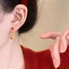 Pendientes de alta gama Sense para mujer, con ambiente festivo de Año Nuevo 2025.