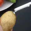 Pelador multifunción de acero inoxidable de tres piezas Gadget multiusos de cocina Pinza para el pelo de pato Rallador para pelar frutas
