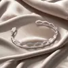 Moda Europeia e Americana Pulseira de Metal Aço Titânio para Mulheres com Design Geométrico Diamante Fivela de Mola Pulseira Recortada Série de Emendas Multicamadas