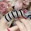 Anillo de Anillo de Rueda de Diamante Completo de Diseño de Industria Pesada Camelia Mismo Estilo que Jackson Wang Anillo de Anillo de Diamante de Fila de Obsidiana de Gama Alta para Hombres y Mujeres