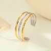 Pulsera de apertura dorada de acero inoxidable, artesanía de presión de aceite, joyería transfronteriza europea y americana de primera calidad, pulsera de titanio de alta calidad que no se decolora
