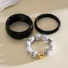 Pulsera redonda de resina con incrustaciones de diamantes de colores transfronteriza europea y americana, brazalete estilo vintage vacacional, lujo ligero, sensación de alta gama, accesorio versátil