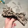 Outono e Inverno Novo Presilha Banana de Lã com Estampa de Leopardo e Laço Grampo de Cabelo Presilha Vertical para Rabo de Cavalo Alto Presilha Torcida Acessórios de Cabelo de Alta Qualidade para Mulheres