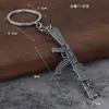Venta al por mayor transfronteriza mini pistola de metal colgante para coche para hombre supervivencia Jedi periférico modelo de simulación llavero de pistola