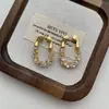 Pendientes de Zirconia Chapados en Oro Cobre Ultra Brillantes de Alta Calidad, Moda de Lujo Ligero Simples de Gama Alta Versátiles Estilo Oro