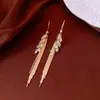 Pendientes de borla con flor de trébol de circonita vintage con un toque de alta gama, pendientes versátiles y de moda al por mayor