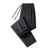 Calça esportiva seis-prova transfronteiriça, modelo novo, para jovens homens, quente, à prova de vento, à prova d'água, forrada com fleece, calça comprida para outono e inverno, preta, casual