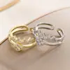 Anel de diamante super brilhante em formato de onda de batimento cardíaco! Design aberto em camada dupla com um toque de luxo leve e nicho, disponível em dourado e prata, estilo versátil