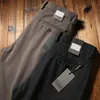 Pantalones de lana gruesa elástica para hombre de otoño e invierno 2023 pantalones de lana cepillada de alta gama rectos holgados de negocios casual