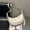 Bolsa transversal estilo preguiçoso formato bolinho feminina 2026 nova casual hobo de ombro bolsa de axila sensação relaxada bolsa de ombro único de mão formato crescente