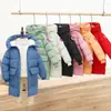 Inverno novas roupas acolchoadas de algodão infantil roupas acolchoadas de algodão médio e longo para meninos e meninas Versão coreana de casaco jaqueta acolchoado de algodão com capuz grosso atacado