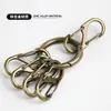 Llavero de Diseño de Nicho Anillo Colgante de Cintura Hebilla en S Elegante Simple Retro Hebilla en Forma de 8 Bronce Llavero de Metal Antirrobo