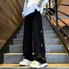 Pantalones casuales estampados estilo americano, nueva colección otoño/invierno, ropa deportiva de moda, pantalones versátiles de corte recto holgado para hombre