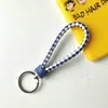Llavero creativo de cuerda de cuero tejido a mano para pareja, llavero de coche, llavero al por mayor, colgante para bolso