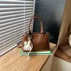 Bolso de mano moderno transfronterizo para mujer, nuevo modelo 2026, bolso de hombro versátil simple y elegante, bolso cruzado de versión coreana para el día a día