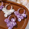 Pendientes largos de estilo Chanel de un solo canal, lujo ligero, elegantes, combinan con todo, perla artificial brillante, color púrpura, pétalos multicapa, pendientes para mujer