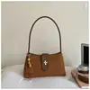Bolso pequeño cuadrado de color sólido retro de alto valor para mujer, nuevo estilo de otoño 2026, bolso de mano de hombro moderno y elegante