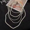 Collar redondo de perlas con cuentas estilo francés, sensación de lujo ligero y alta gama, cadena de suéter de doble capa, accesorio de nicho de diseño único para mujer