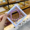 Libro Caperucita Roja Mismo Estilo Estudiante Pulsera de Glaseado de Palomitas de Maíz Hecha a Mano con Cuentas Dibujos Animados Cristal Pulsera Infantil Venta al por Mayor Cajas de Regalo