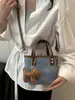 Nova bolsa feminina 2025 bolsa balde quente outono e inverno design de nicho bolsa tiracolo de ombro único bolsa de mão de alta qualidade