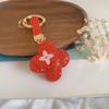 Novo chaveiro criativo de trevo de quatro folhas incrustado de diamantes DIY pingente de bolsa temperamento de luxo leve chaveiro de cerâmica macia para carro