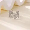 Europeo y Americano Creativo Hueco Flor de Cinco Pétalos Flor de Margarita Anillo de Acero de Titanio Pendientes Pulsera Juego de Joyería Verano Transfronterizo Producto Caliente