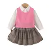 Conjunto de tres piezas para niñas de primavera y otoño, nuevo chaleco de punto + camisa blanca de manga larga + falda corta a cuadros, estilo preppy