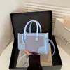 Bolsa tote color-block estilosa para mulheres, nova coleção 2026, perfeita para o dia a dia, bolsa de ombro versátil, tote transversal moderno