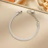 Pulsera de acero de titanio de cuerpo entero de venta caliente transfronteriza para mujer, temperamento de lujo ligero, coreana, galvanoplastia de oro real de 18K, venta al por mayor de joyería