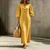 Vestido Largo Casual Delgado para Vacaciones con Cuello en V Abotonado y Mangas Abullonadas, Estilo Europeo y Americano Transfronterizo para Mujer 2026