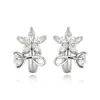 Pendientes de Aro Geométricos con Diseño de Flor de Círculo Xuping Aleación de Cobre Chapado en Blanco Pendientes de Aro Transfronterizos Europeos y Americanos para Mujer