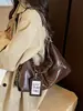 Nueva bolsa de hombro para axilas de diseño de nicho versátil de moda transfronteriza, bolsa cruzada de alta gama de gran capacidad, bolsa de albóndigas para commuter