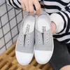 Zapatos de Lona de Caña Baja Nuevos 2025 Zapatos Planos Casuales para Estudiantes Zapatos de Mujer Slip-On Zapatos Perezosos Zapatos Blancos Dropshipping