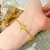 Mesmo estilo loja de ouro areia de ouro laser pulseira de cabaça nova escama de peixe pulseira de trevo de quatro folhas de cinco pétalas joia de mão fresca e de luxo leve