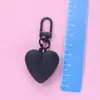 Llavero de corazón de melocotón nuevo color caramelo amor funda protectora aipods funda para auriculares colgante adornos para bolso