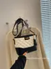 Bolso pequeño cuadrado de rombos de color contrastante para mujer 2026 nuevo sensación de alta gama bolso de axila versátil correa ancha para el hombro bandolera bolso pequeño