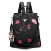 Comércio exterior mochila moda quente feminina 2024 moda coreana versátil tecido Oxford mochila antifurto bolsa feminina com pingente