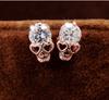 Nueva versión coreana de pendientes joyería de moda nicho personalidad creativa circonita calavera cabeza de fantasma pendientes venta al por mayor