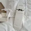 Calcetines de otoño e invierno vintage de encaje con lazo hasta la mitad de la pantorrilla para mujer, calcetines holgados a rayas y lunares estilo coreano, calcetines de algodón sin costuras para mujer al por mayor